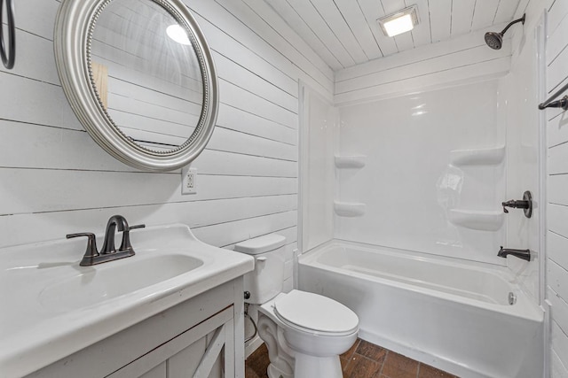 full bathroom with  shower combination, toilet, wooden walls, vanity, and wood ceiling