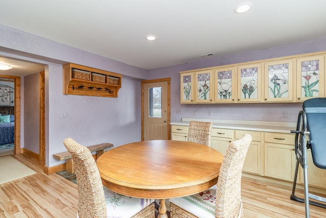 dining area featuring light wood-type flooring