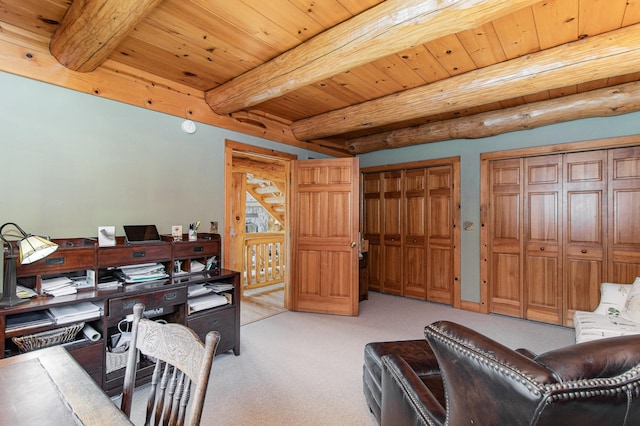 office with beam ceiling, light carpet, and wooden ceiling