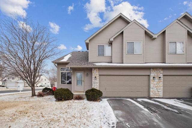 townhome / multi-family property featuring a garage