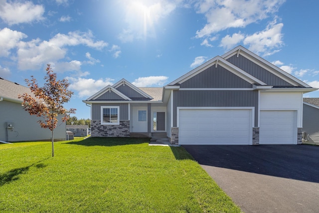 craftsman house with a garage and a front yard