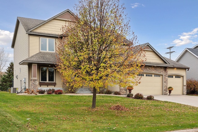 obstructed view of property with a front yard, a garage, and central AC unit