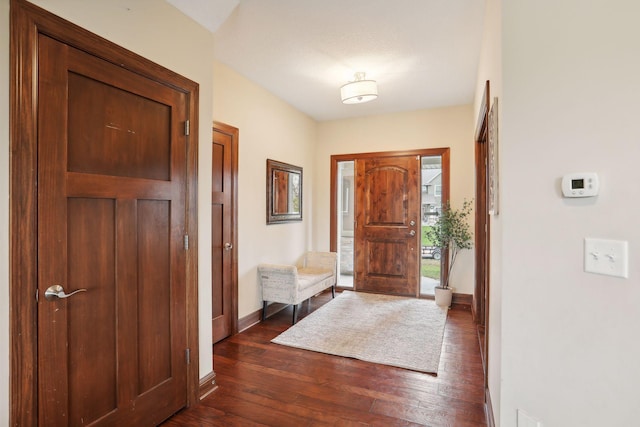 foyer entrance with dark hardwood / wood-style flooring