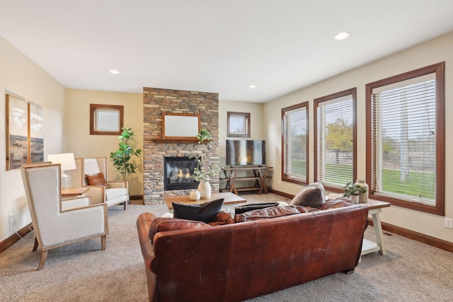 carpeted living room with a fireplace