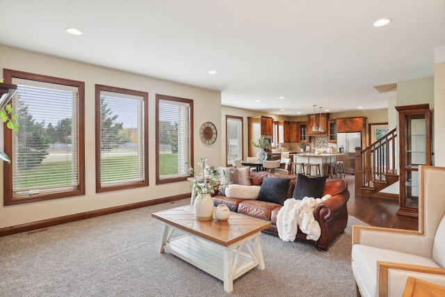 living room featuring dark carpet