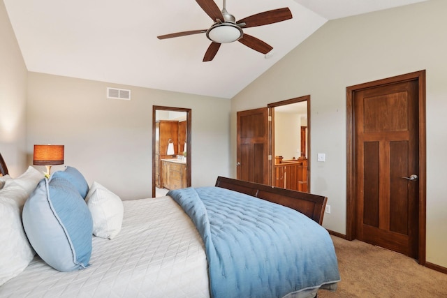 carpeted bedroom featuring ceiling fan, connected bathroom, and vaulted ceiling