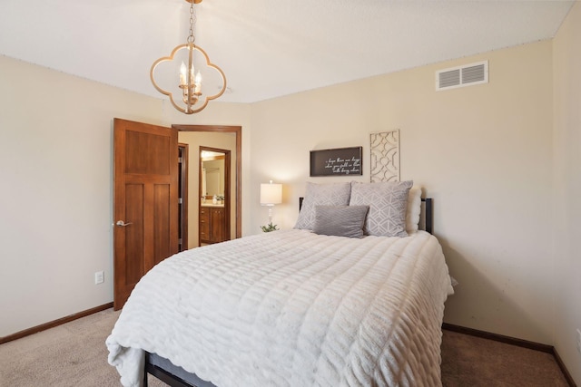 bedroom with light carpet and an inviting chandelier