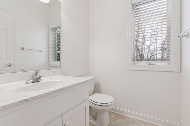 bathroom with tile patterned floors, vanity, and toilet