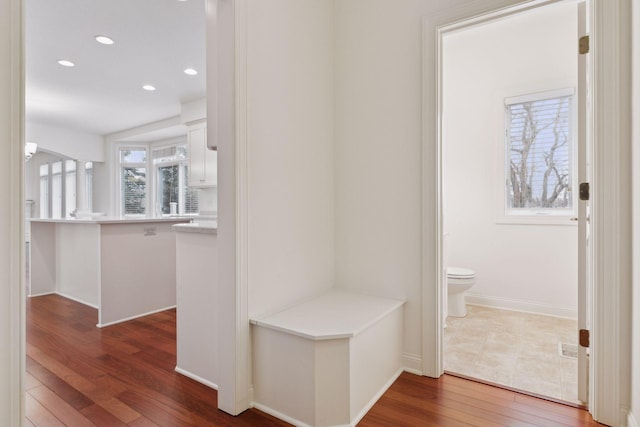 hallway with dark wood-type flooring