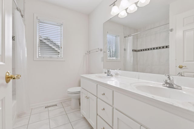 full bathroom with tile patterned flooring, vanity, toilet, and shower / bath combo