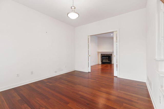 empty room with dark hardwood / wood-style floors