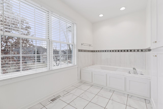 bathroom featuring a tub