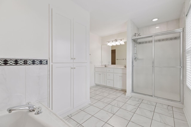 bathroom featuring vanity, walk in shower, and tile walls