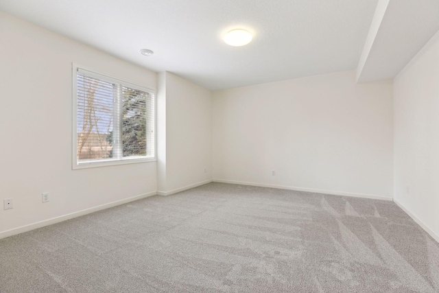 unfurnished room with light colored carpet