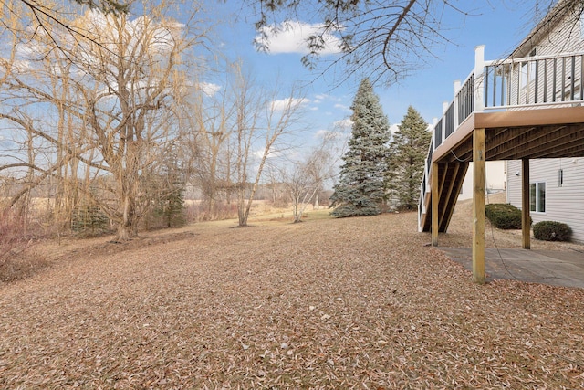 view of yard with a wooden deck