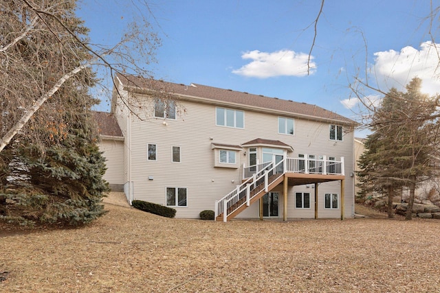 rear view of house featuring a deck