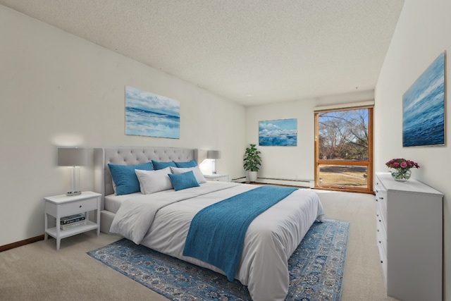 carpeted bedroom featuring a baseboard radiator and a textured ceiling