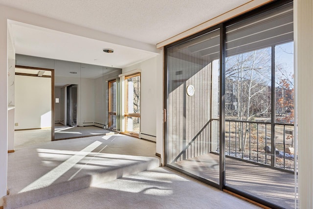 doorway featuring a textured ceiling, floor to ceiling windows, baseboard heating, and carpet