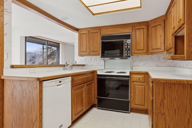 kitchen featuring range with electric stovetop, sink, a textured ceiling, and white dishwasher