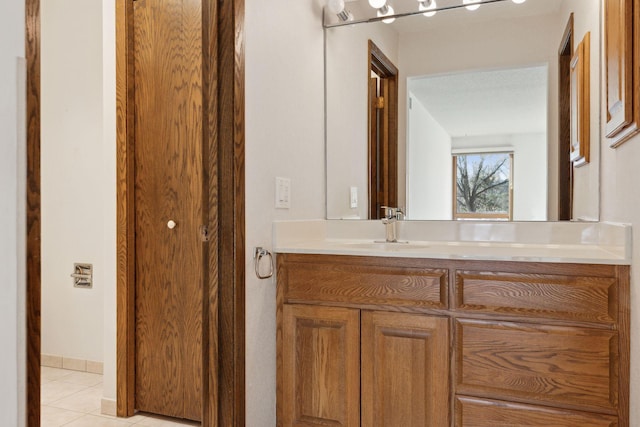 bathroom with vanity and tile patterned flooring