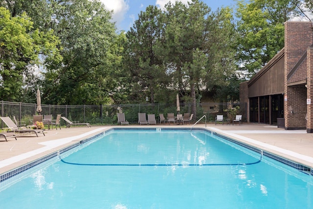 view of swimming pool featuring a patio area