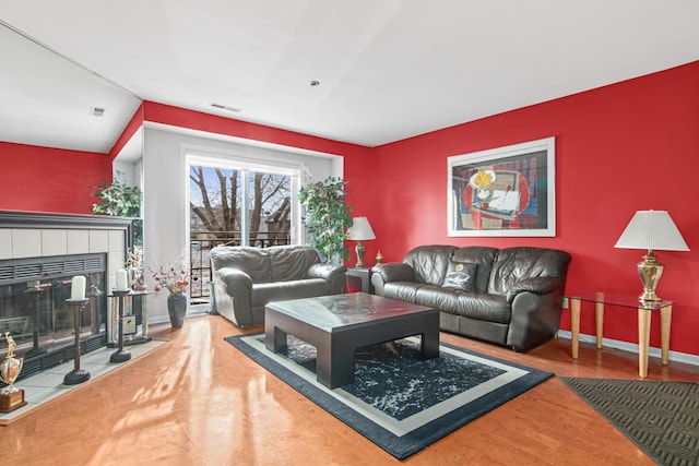 living room featuring hardwood / wood-style floors and a fireplace