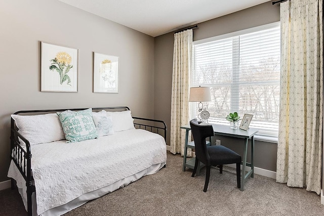 bedroom featuring baseboards and carpet flooring