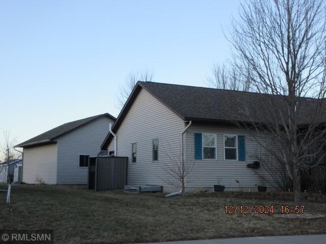 view of property exterior featuring a lawn