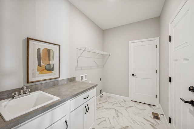 laundry room with cabinets, electric dryer hookup, sink, and washer hookup