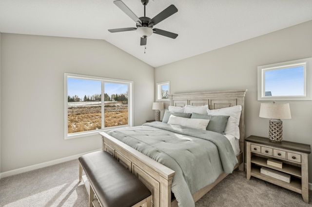 carpeted bedroom featuring lofted ceiling and ceiling fan