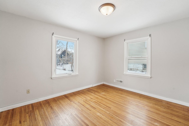 empty room featuring hardwood / wood-style floors