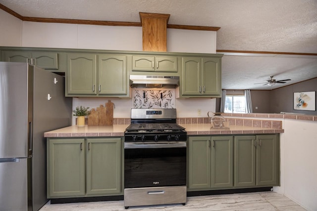 kitchen featuring ventilation hood, green cabinets, ceiling fan, a textured ceiling, and stainless steel appliances