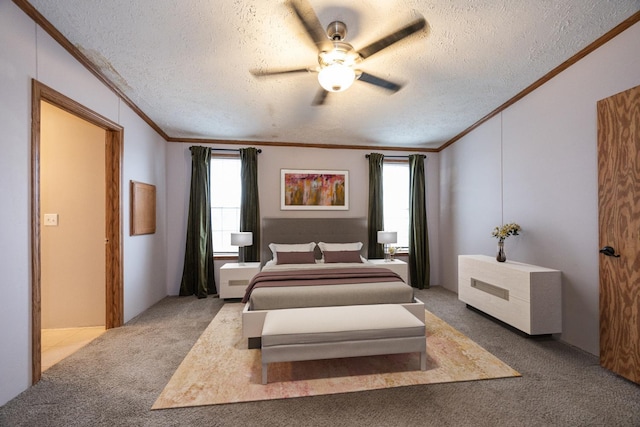 carpeted bedroom featuring a textured ceiling, ceiling fan, and ornamental molding