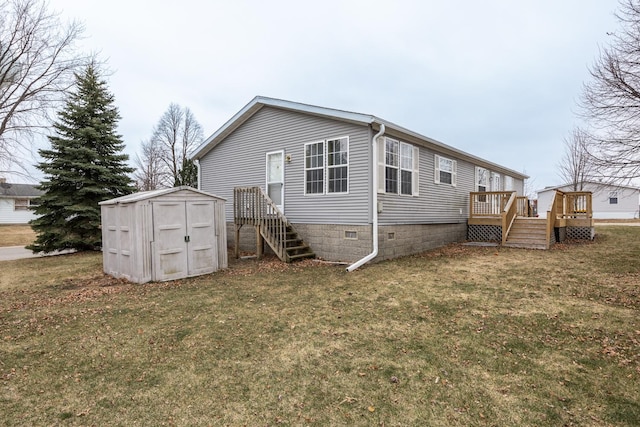 back of property featuring a storage shed, a yard, and a deck