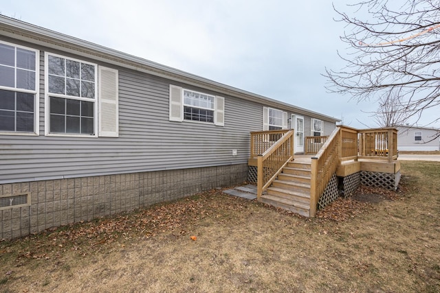 view of home's exterior with a wooden deck