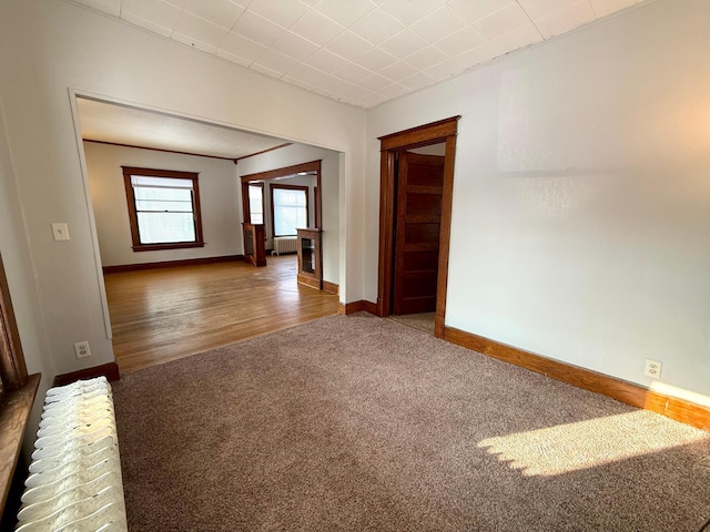 carpeted spare room with radiator