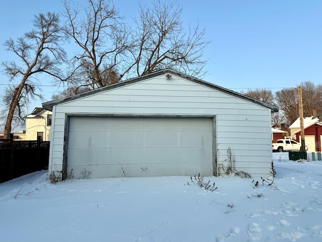 view of snow covered garage