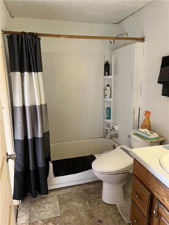 full bathroom with vanity, shower / tub combo, and toilet