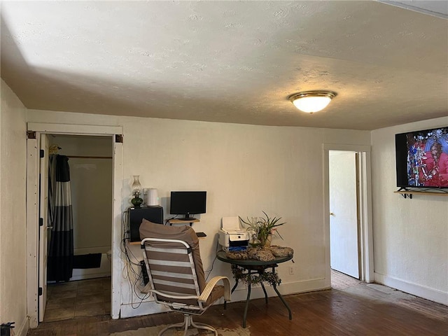 home office with dark wood-type flooring