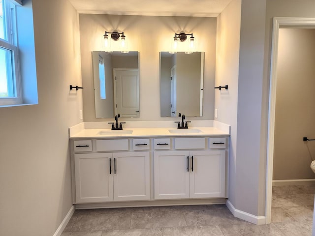 bathroom with toilet and vanity