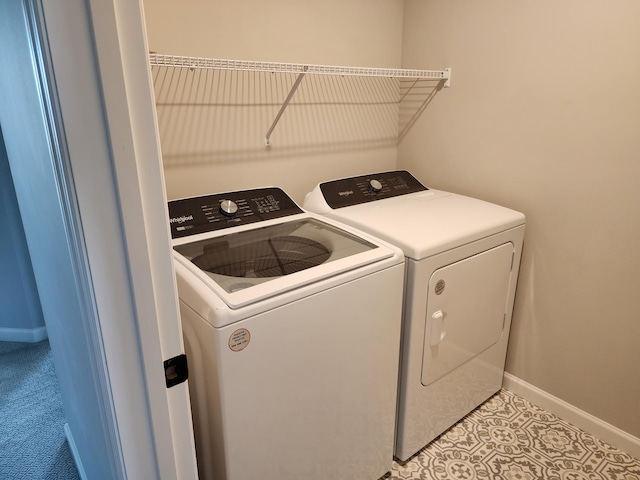 laundry area with washing machine and dryer