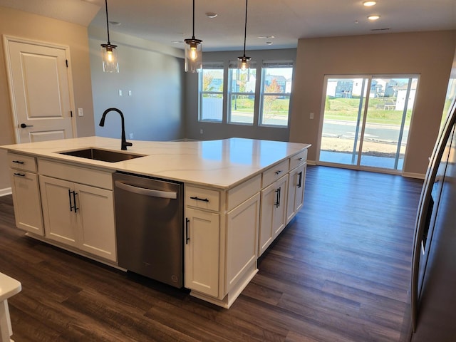 kitchen featuring white cabinetry, sink, hanging light fixtures, and stainless steel dishwasher