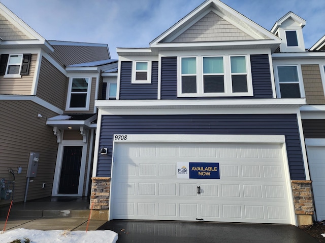 view of front of property with a garage