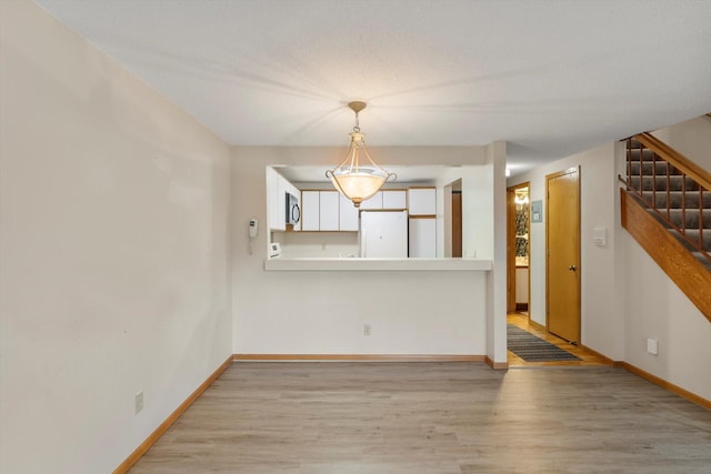 empty room with light wood-type flooring