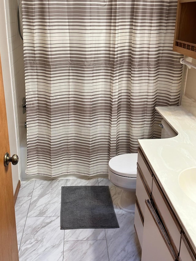 full bathroom featuring vanity, shower / bath combination with curtain, and toilet