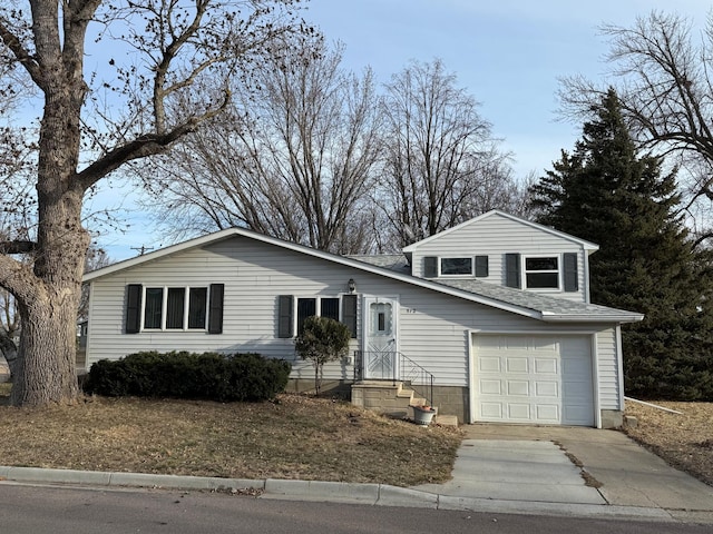 split level home with a garage