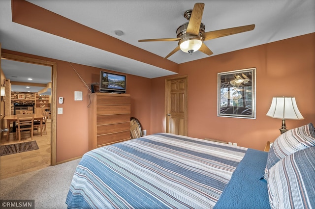 bedroom with light carpet and ceiling fan