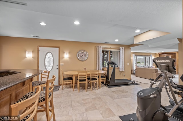 workout room featuring bar area