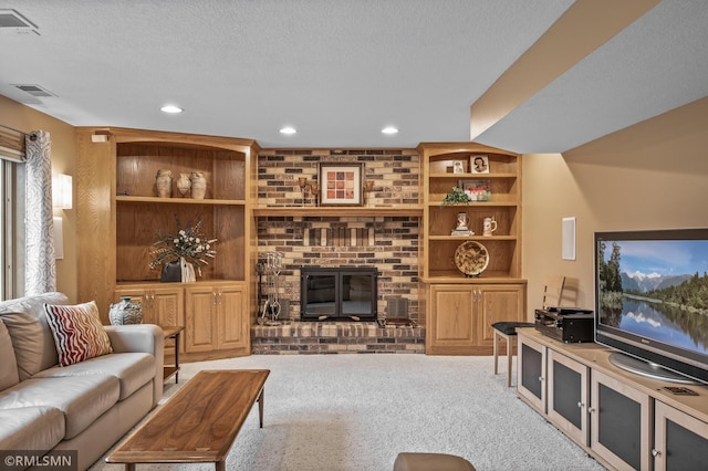 living room featuring light carpet, a fireplace, and a textured ceiling