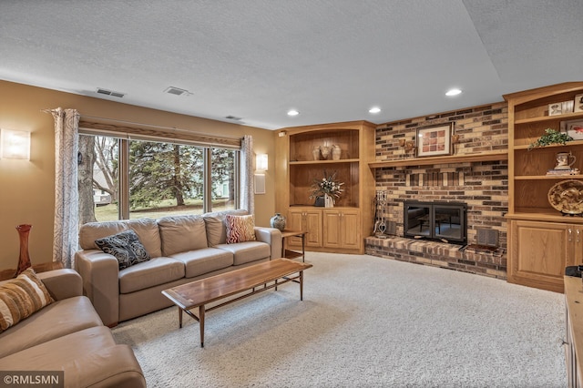 carpeted living room with a fireplace and a textured ceiling